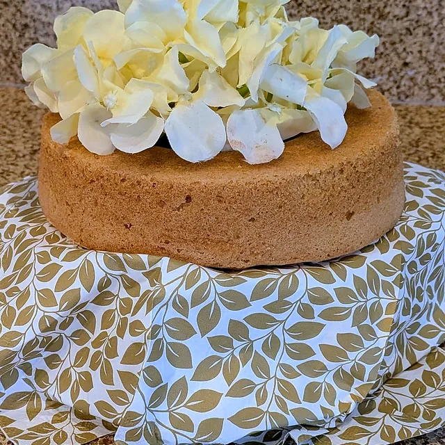Cake topped with cream flowers